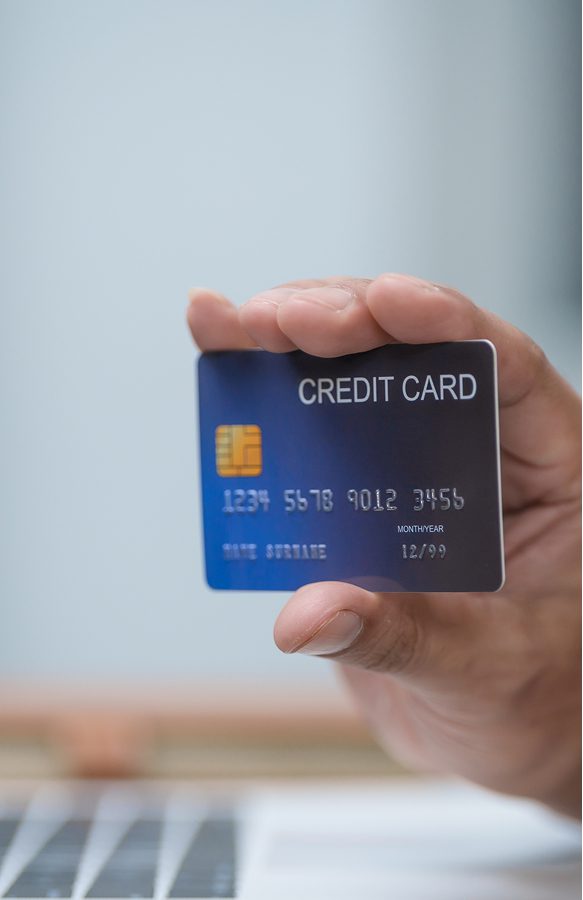 Hand displaying a credit card